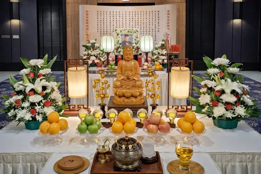 Buddhist chanting altar with Heart Sutra backdrop